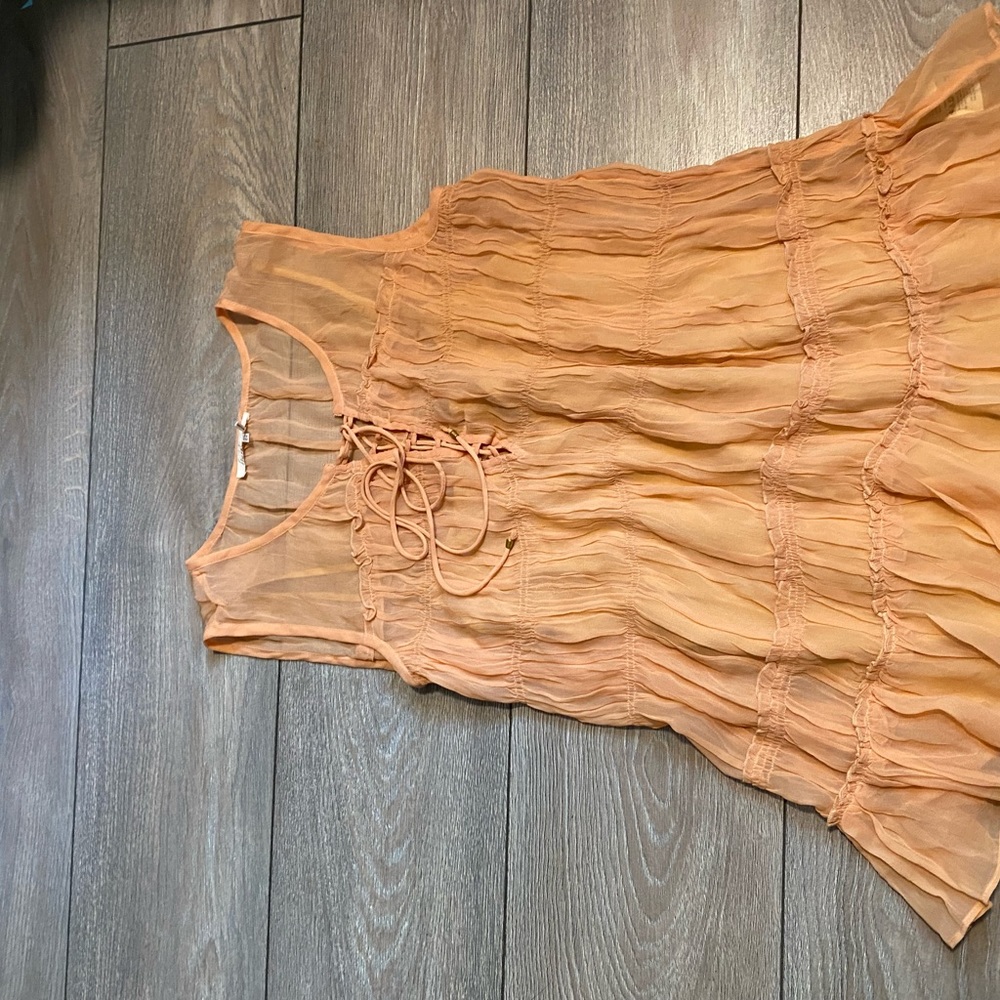 Flareat tank top. Sz med. lined with adjustable straps. Peach color